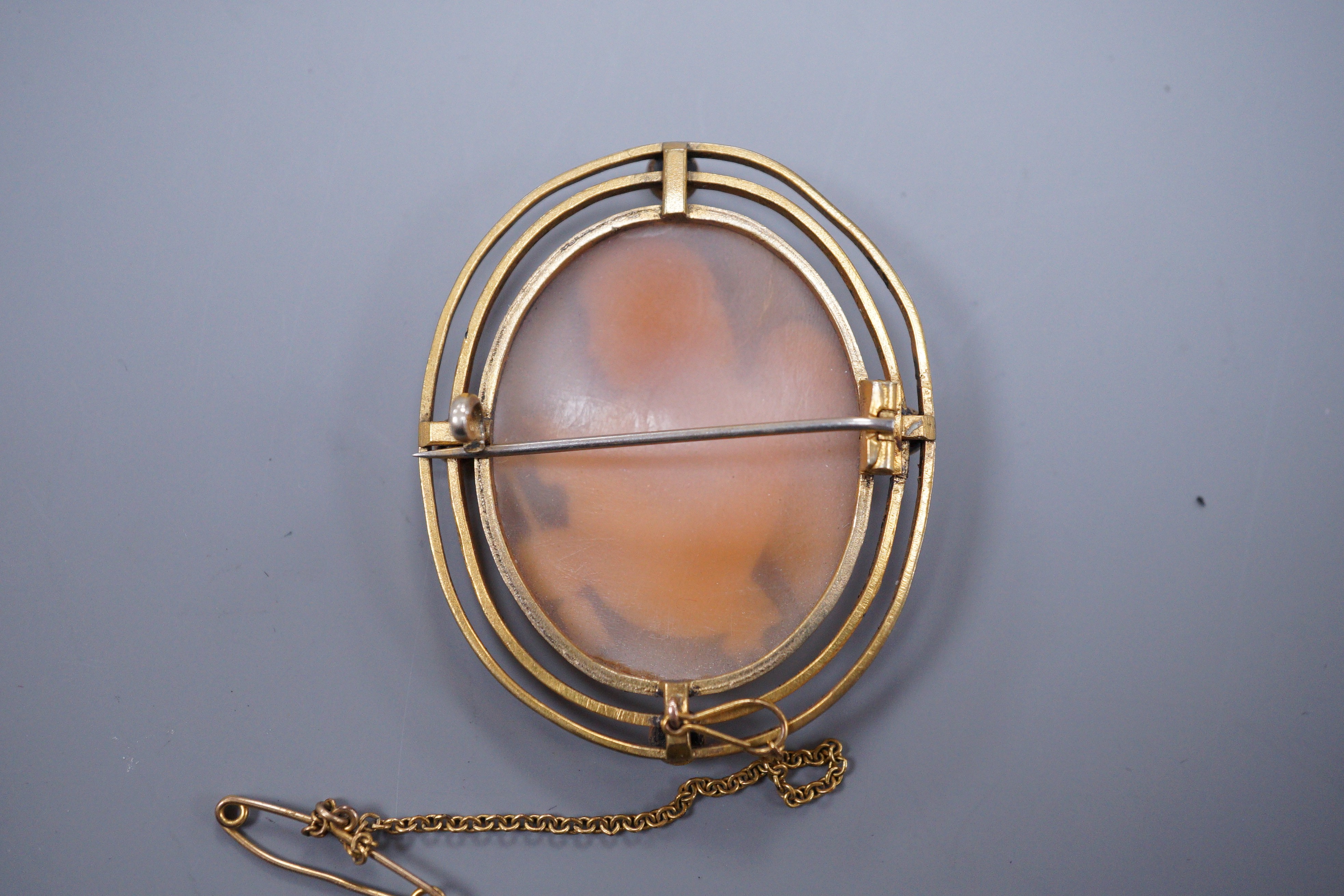 A 19th century gilt metal mounted cameo brooch carved with Cupid, 4.5cm
